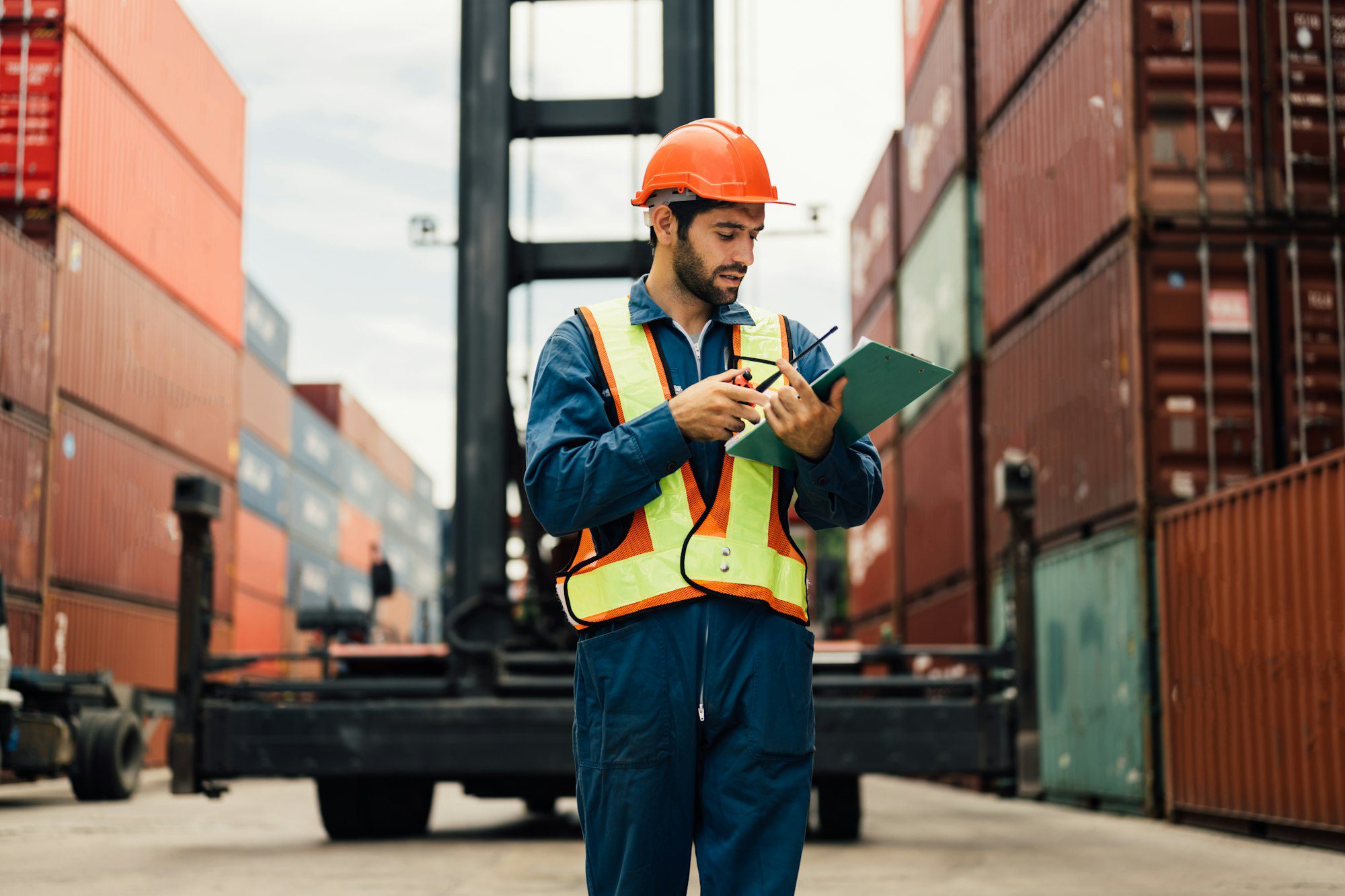 Warehouse engineer worker working at industrial container yard