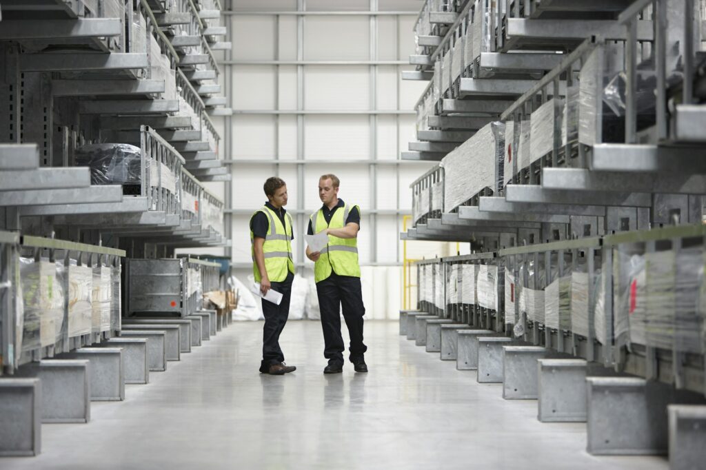 Warehouse workers in engineering warehouse